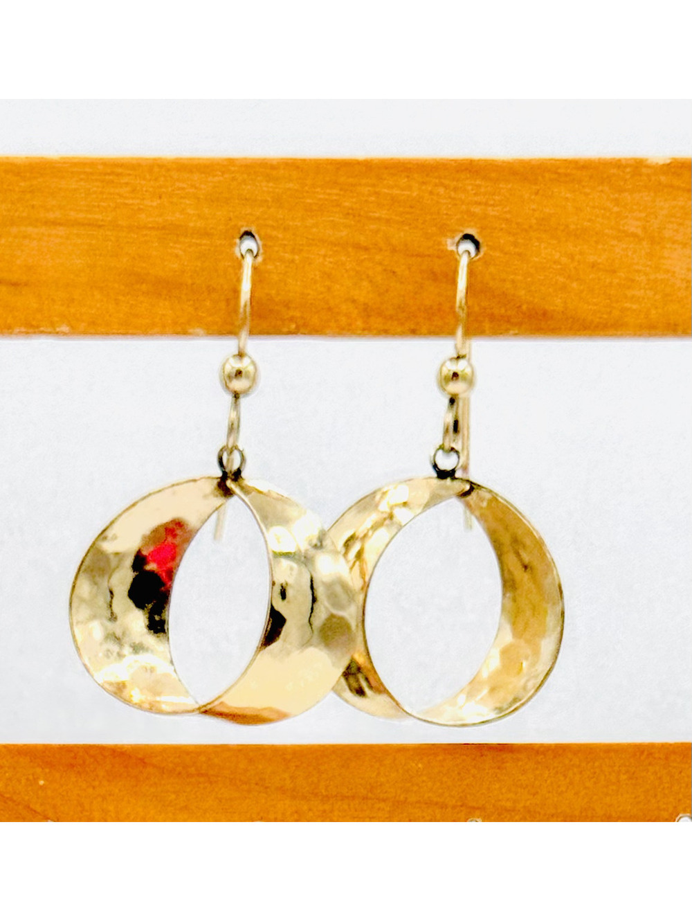 Gold tone hook dangle hoop earrings